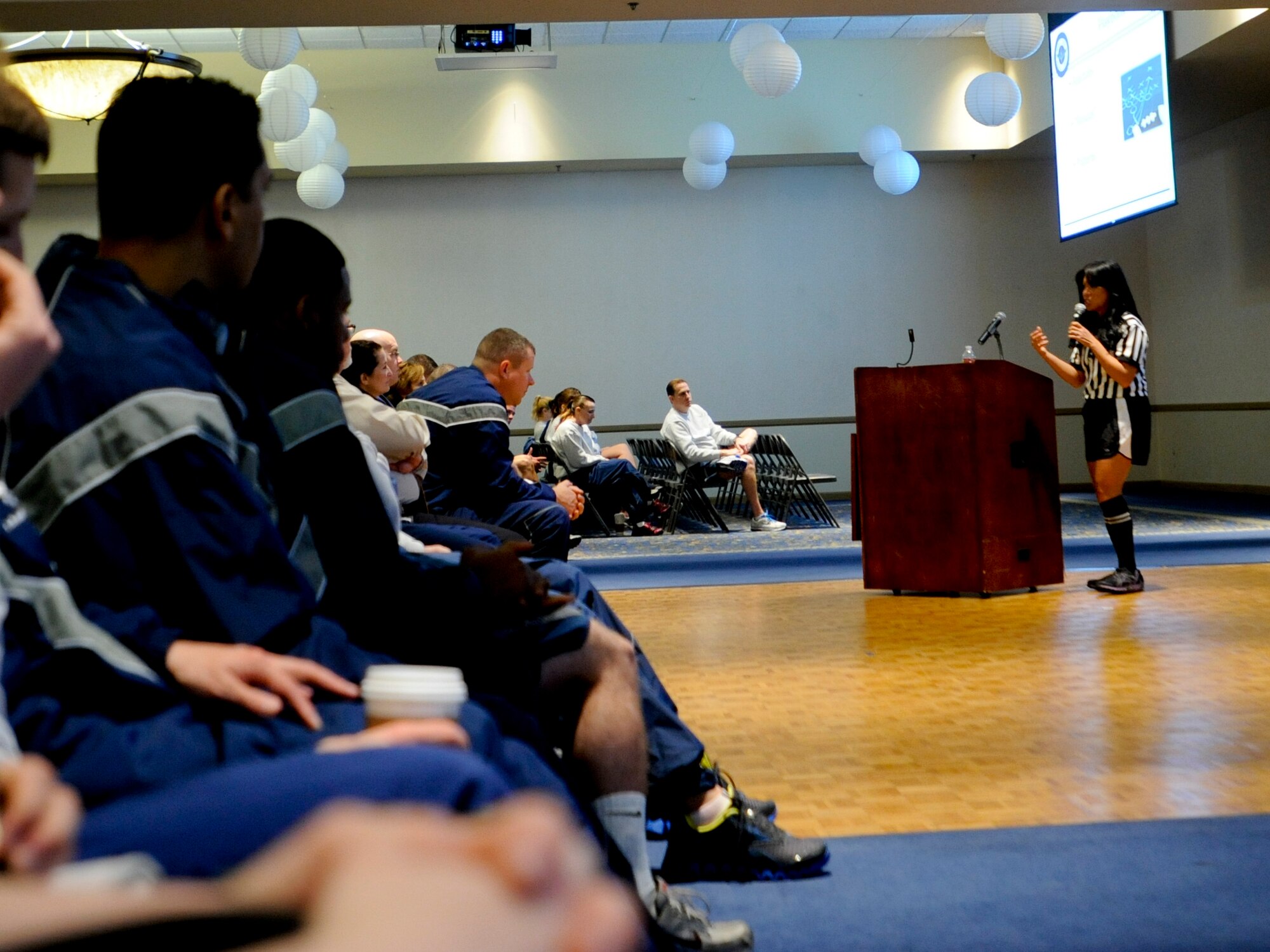 VANDENBERG AIR FORCE BASE, Calif. – Pauline Chui, 30th Space Wing outreach program manager, speaks to the Airman about “checking your playbook” at the Pacific Coast Club here Friday, March 15, 2013. Wingman Day events gave more than 4,000 Team V members the opportunity to interact with one another and to learn about different topics such as branding yourself and interpersonal relationships. (U.S. Air Force photo/Airman Yvonne Morales)