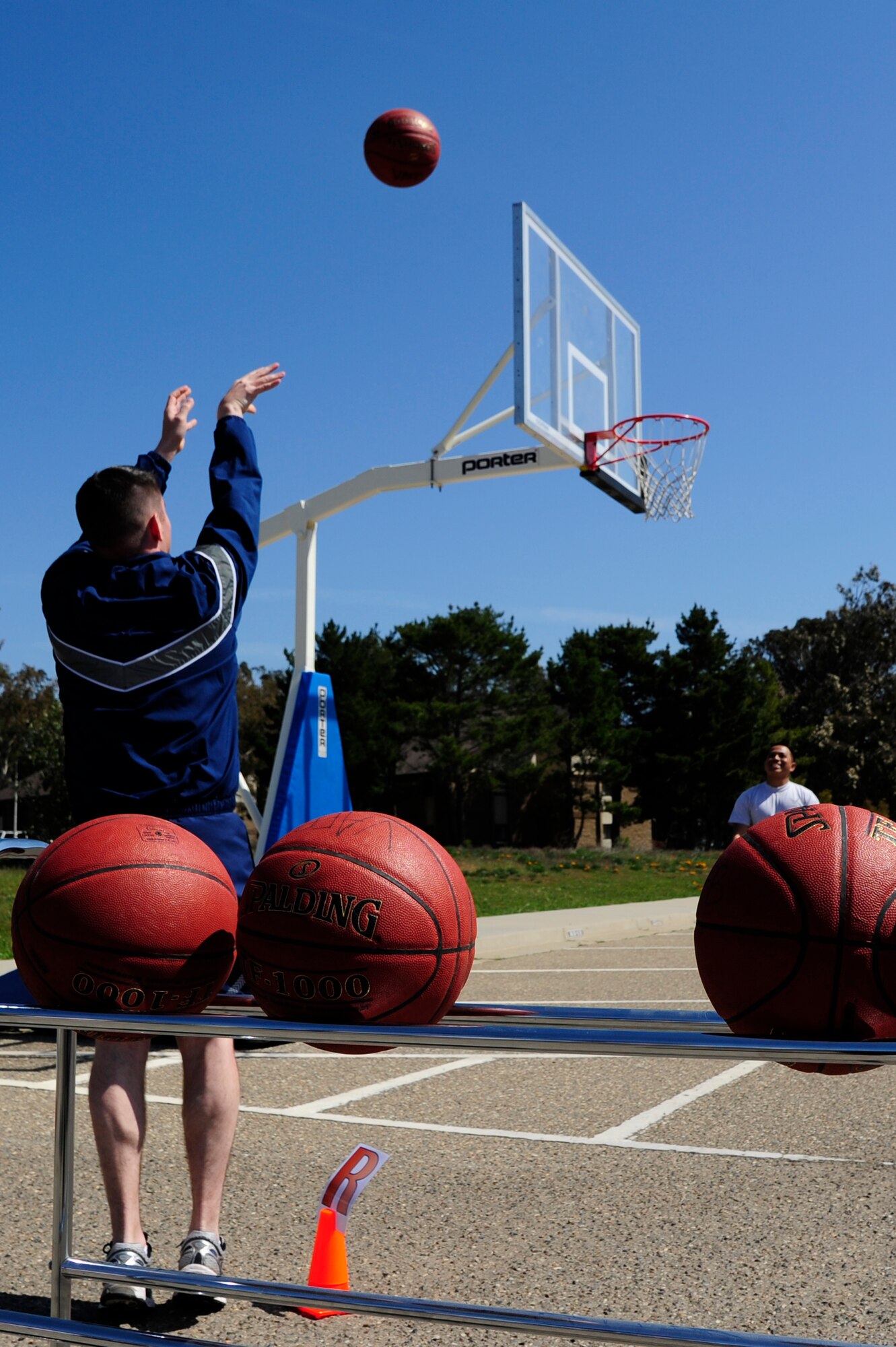 VANDENBERG AIR FORCE BASE, Calif. – Members of each unit throughout the 30th Space Wing took turns shooting baskets at seven different points around the court for a trophy during Wingman Day at the Pacific Coast Club parking lot here Friday, March 15, 2013. More than 4,000 Airmen attended Wingman University to learn different topics such as intrapersonal relationship skills and becoming an effective leader. (U.S. Air Force photo/Senior Airman Lael Huss)