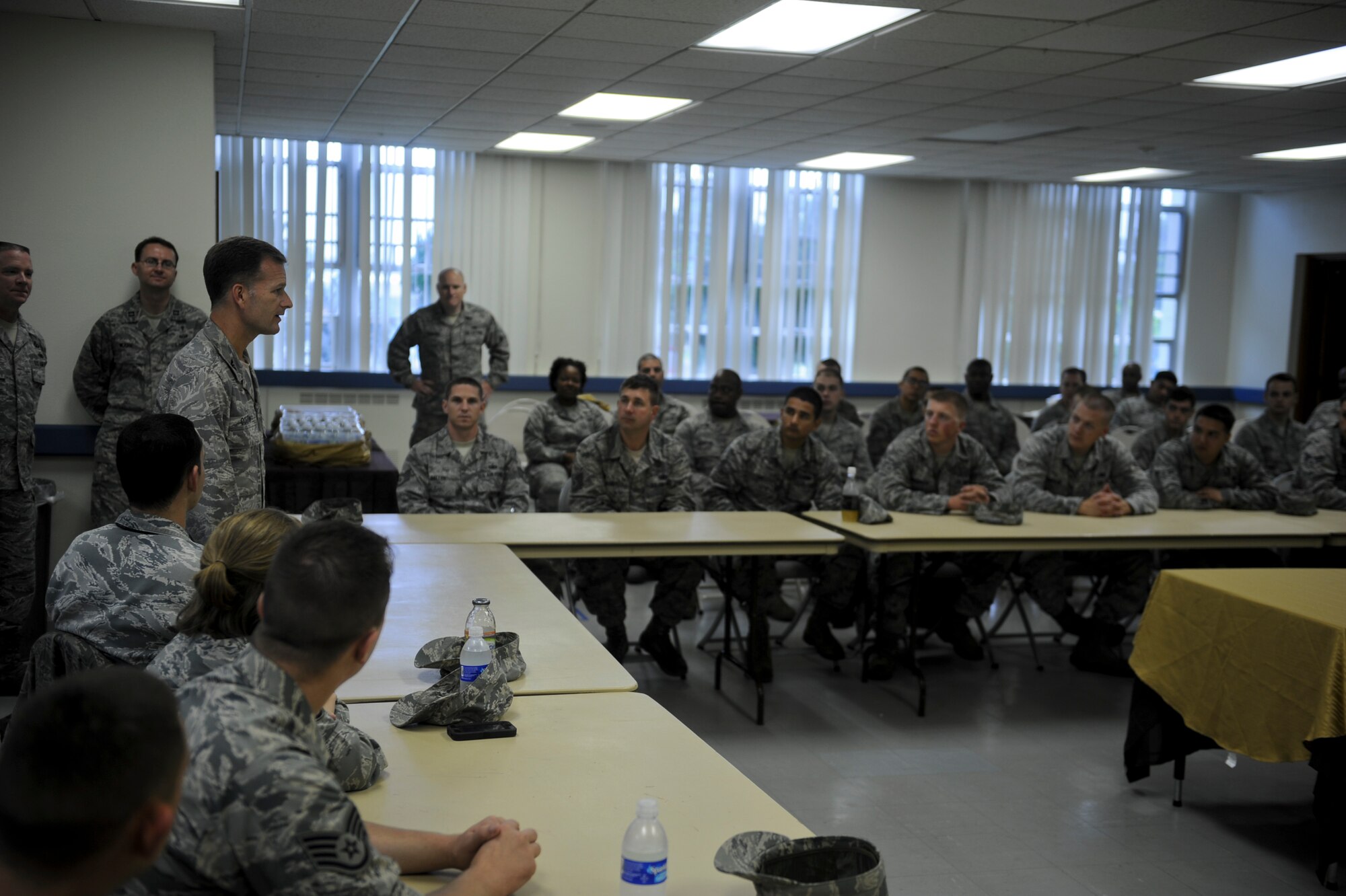 U.S. Air Force Chaplain (Col.) Dondi Costin, Pacific Air Forces command chaplain, talks to Airmen on Kadena Air Base, Japan, March 18, 2013. During his visit to Kadena, Costin checked the chapel's facilities to acquire the needs, wants and concerns of the Airmen. (U.S. Air Force photo/Airman 1st Class Justin Veazie)