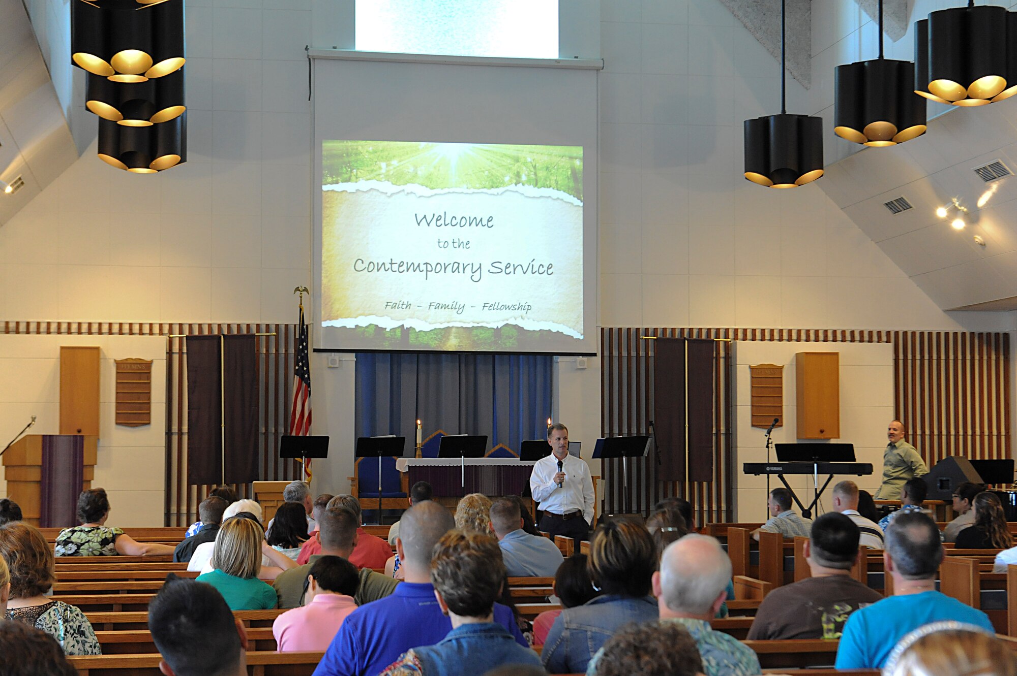 U.S. Air Force Chaplain (Col.) Dondi Costin, Pacific Air Forces command chaplain, talks to Kadena service members and their families at the contemporary worship service on Kadena Air Base, Japan, March 17, 2013. Costin represents and advises the PACAF commander on all aspects of the chaplain corps mission in direct support of operations throughout the Pacific region. (U.S. Air Force photo/Airman 1st Class Malia Jenkins)