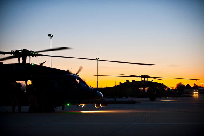 A two-ship of HH-60 Pave Hawks from the 34th Weapons Squadron of the  U.S. Air Force Weapons School out of Nellis Air Force Base, Nev., taxi down a runway after arriving for the terminal employment phase March 8, 2013, at Gowen Field, Idaho. Four weapons school students will be put to the test to demonstrate maximum combat effectiveness. (U.S. Air Force photo by Senior Airman Brett Clashman)