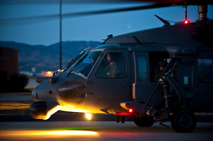 An HH-60 Pave Hawk from the 34th Weapons Squadron of the U.S. Air Force Weapons School out of Nellis Air Force Base, Nev., taxis down a runway after arriving for the terminal employment phase March 8, 2013, at Gowen Field, Idaho. The "T.E." mission objective is to demonstrate and instruct HH-60 weapons employment and landing zone options to maximize weapons effectiveness and quickly recover survivors. (U.S. Air Force photo by Senior Airman Brett Clashman)