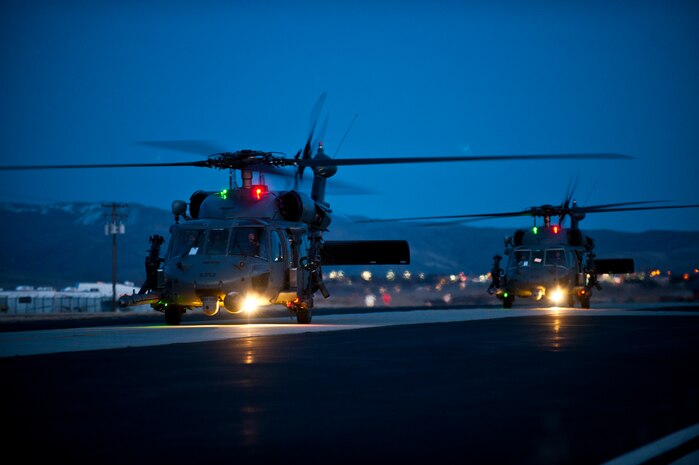 A two-ship of HH-60 Pave Hawks from the 34th Weapons Squadron of the U.S. Air Force Weapons Schoolout of  Nellis Air Force Base, Nev., taxi down a runway after arriving for the  terminal employment phase March 8, 2013, at Gowen Field, Idaho. The "T.E." mission objective is to demonstrate and instruct HH-60 weapons employment and landing zone options to maximize weapons effectiveness and quickly recover survivors. (U.S. Air Force photo by Senior Airman Brett Clashman)