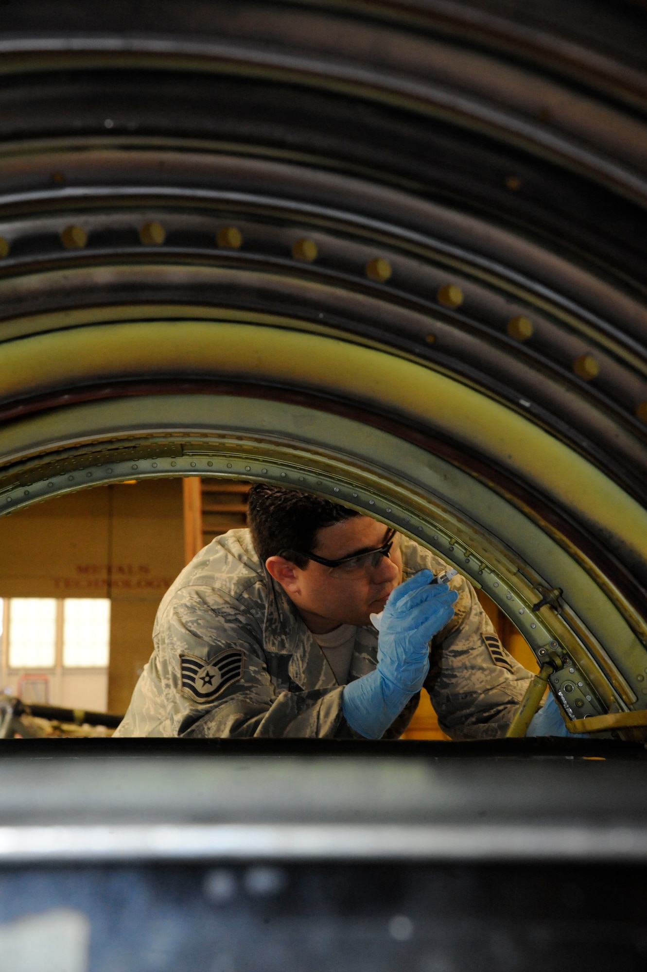 Staff Sgt. Dustin Reynolds, 2nd Maintenance Squadron Aircraft Structural Maintenance, paints a B-52H Stratofortress upper body cowling on Barksdale Air Force Base, La., March 18. The aircraft structural maintenance section has the responsibility of maintaining the structural integrity of the B-52H Stratofortress by removing corrosion, repairing cowlings and repainting the skin. (U.S. Air Force photo/Airman 1st Class Andrew Moua)
