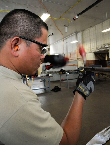 Staff Sgt. Steven Gutierrez, 2nd Maintenance Squadron Aircraft Structural Maintenance, hammers a nacelle strut trailing edge on Barksdale Air Force Base, La., March 18. The aircraft structural maintenance section has the responsibility of maintaining the structural integrity of the B-52H Stratofortress by removing corrosion, repairing cowlings and repainting the skin. (U.S. Air Force photo/Airman 1st Class Andrew Moua)