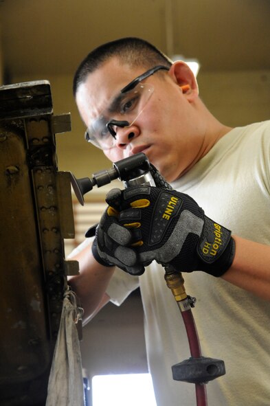 Staff Sgt. Steven Gutierrez, 2nd Maintenance Squadron Aircraft Structural Maintenance, sands a nacelle strut trailing edge on Barksdale Air Force Base, La., March 18. The aircraft structural maintenance section has the responsibility of maintaining the structural integrity of the B-52H Stratofortress by removing corrosion, repairing cowlings and repainting the skin. (U.S. Air Force photo/Airman 1st Class Andrew Moua)