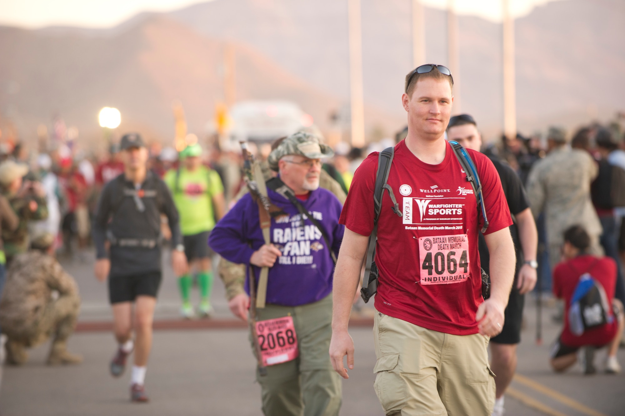 Participants in the Bataan Memorial Death March begin the marathon at White Sands Missile Range, N.M., March 17. The event included both a full 26.2-mile marathon and a 15.2-mile honorary march. More than 5,800 people from across the world participated in the 26.2-mile memorial march to honor the 76,000 prisoners of war who were forced to endure marching nearly 80 miles under brutal conditions during World War II. (U.S. Air Force Photo by Airman 1st Class Michael Shoemaker/Released)