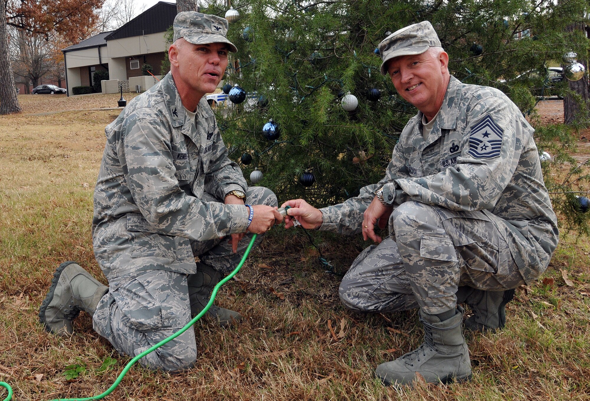 Members of the First Four, on behalf of Chief Master Sgt. Wendell Peacock, 94th Airlift Wing command chief, invited Dobbins Air Reserve Base personnel out to decorate the base holiday tree near the front gate, Nov. 30.(U.S. Air Force photo/Senior Airman Elizabeth Van Patten)