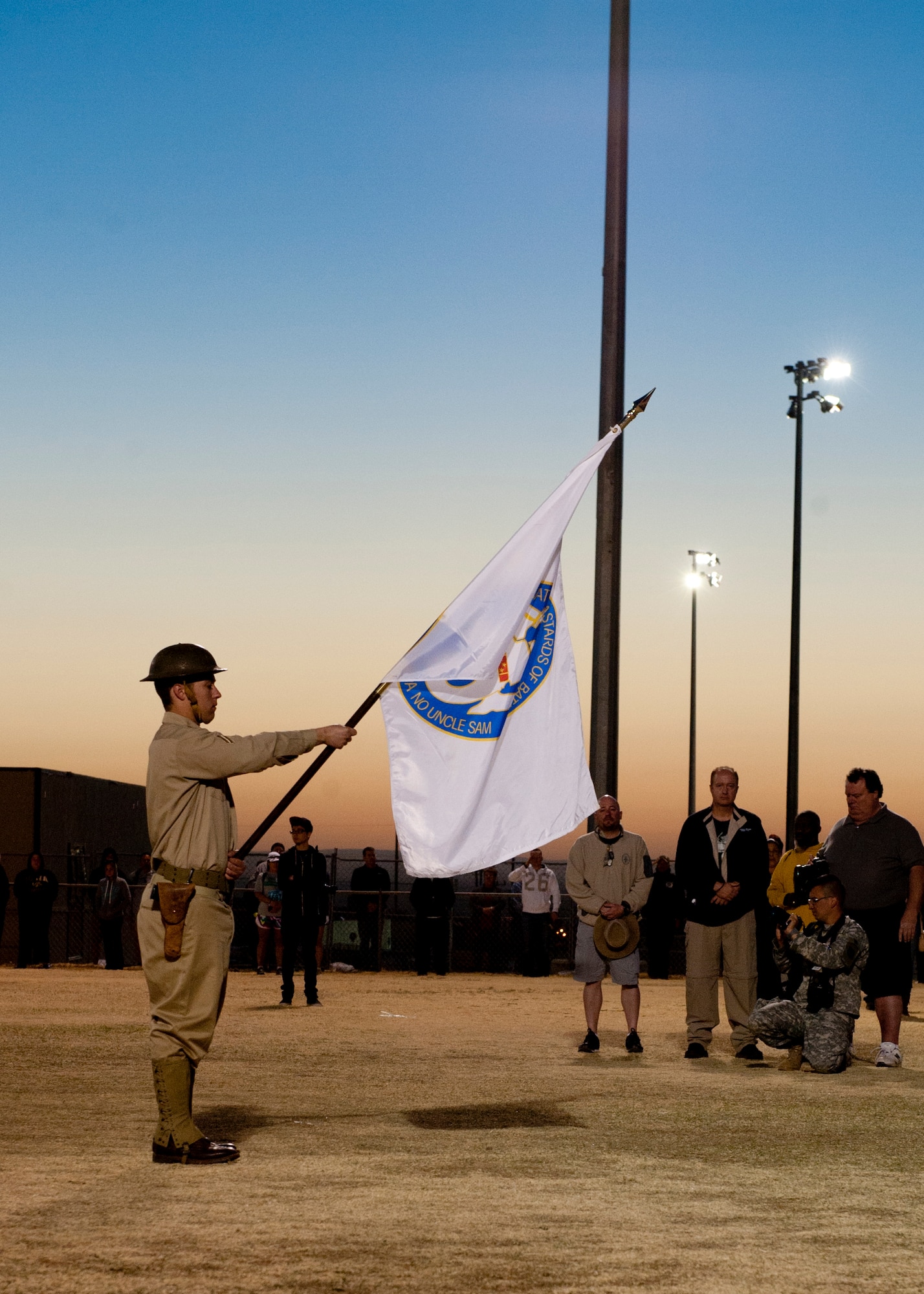 A U.S. Army service member posts the flag of the Battling Bastards of Bataan at the opening ceremony of the 24th annual Bataan Memorial Death March at White Sands Missile Range, N.M., March 17. More than 5,800 people who were from across the world participated in the 26.2-milememorial marathon to honor the 76,000 prisoners of war forced to endure marching nearly 80 miles under brutal conditions during World War II. The event began around 7 a.m., and the course stayed open until 8 p.m., when darkness fell, and it was no longer safe for participants to continue. (U.S.  Air Force photo by Airman 1st Class Daniel E. Liddicoet/Released)