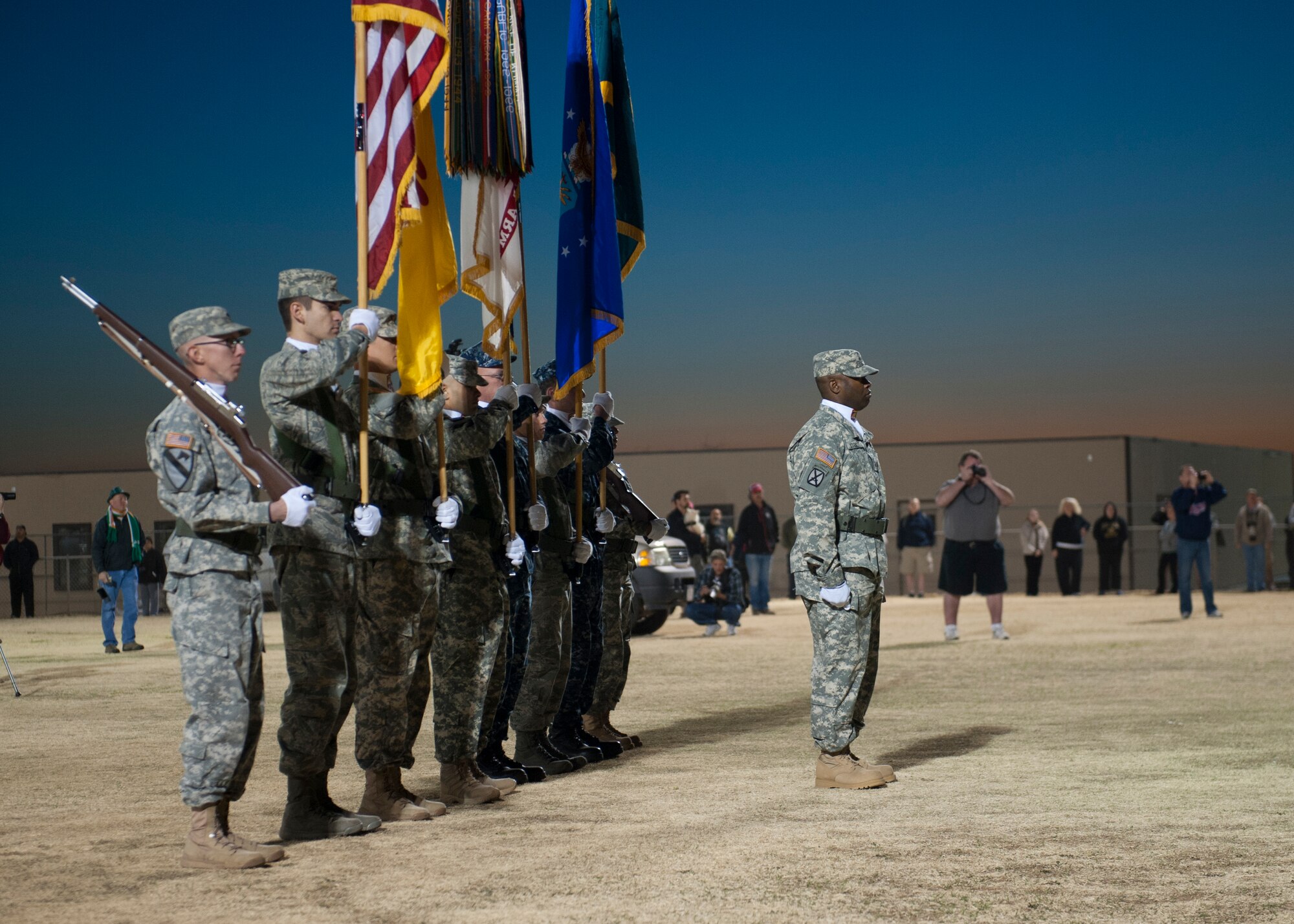 The White Sands Missile Range honor guard posts the colors during the opening ceremony of the 24th annual Bataan Memorial Death March at White Sands Missile Range, N.M., March 17. More than 5,800 people who were from across the world participated in the 26.2-milememorial marathon to honor the 76,000 prisoners of war forced to endure marching nearly 80 miles under brutal conditions during World War II. The event included both a full 26.2-mile marathon and a 15.2-mile honorary march. (U.S.  Air Force photo by Airman 1st Class Daniel E. Liddicoet/Released)