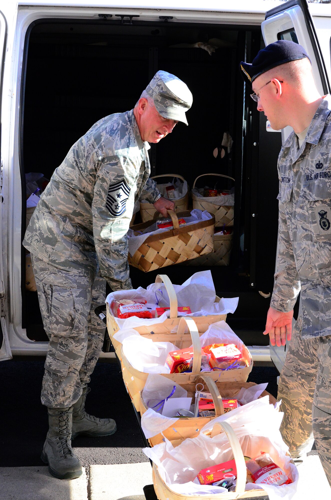 Chief Master Sgt. Wendell Peacock, 94th Airlift Wing command chief, assisted members of the Dobbins First Sergeants Council, Dobbins Human Resource Development Council, the Lonely Hearts Club and Military Order of the Purple Heart -Chapter 576 on Dec. 5. The groups met to assemble baskets of holiday food for Airmen in need at Dobbins Air Reserve Base. (U.S. Air Force photo/Senior Airman Elizabeth Van Patten)