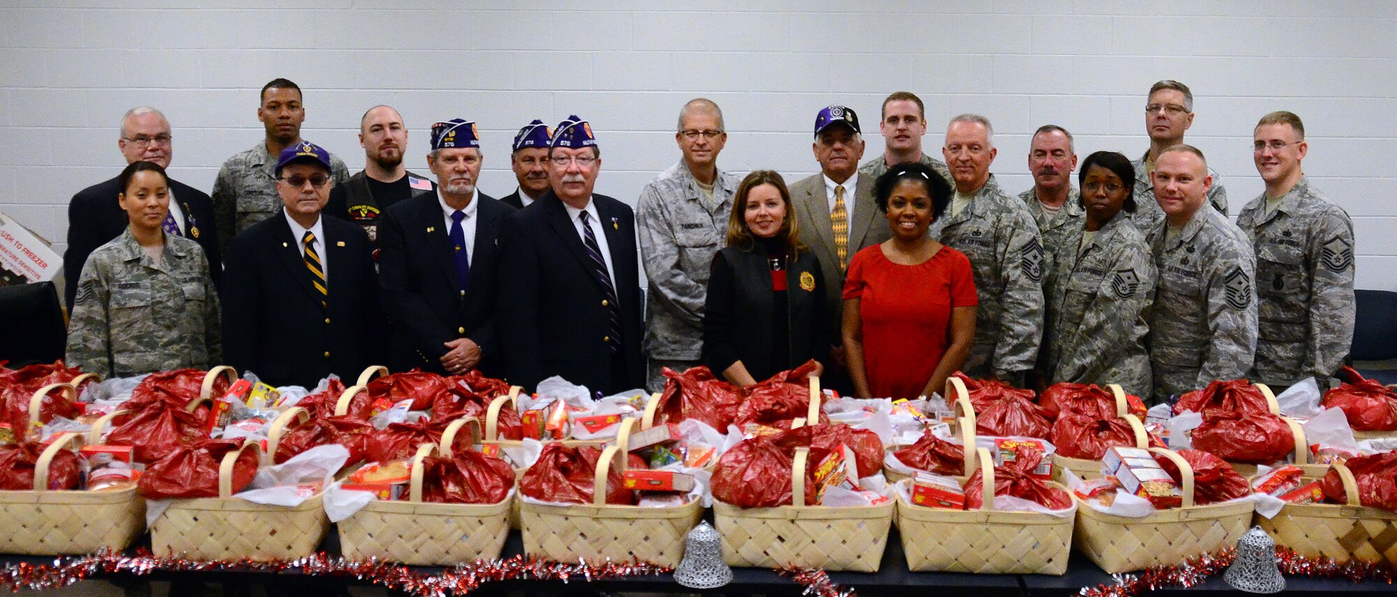 Members of the Dobbins First Sergeants Council, Dobbins Human Resource Development Council, the Lonely Hearts Club and Military Order of the Purple Heart -Chapter 576 met on Dec. 5 to assemble baskets of holiday food for Airmen in need at Dobbins Air Reserve Base. (U.S. Air Force photo/Senior Airman Elizabeth Van Patten)