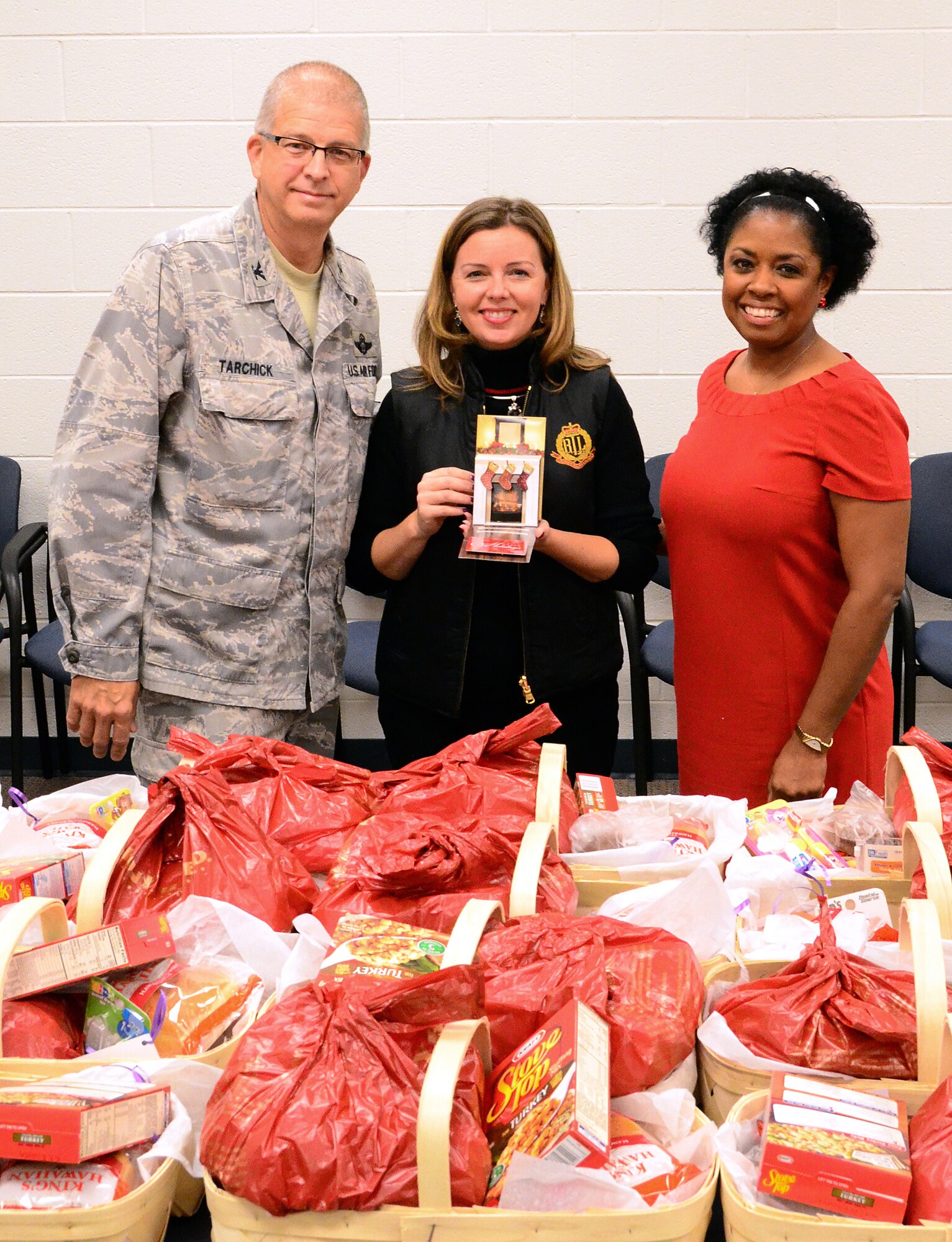 Members of the Dobbins First Sergeants Council, Dobbins Human Resource Development Council, the Lonely Hearts Club and Military Order of the Purple Heart -Chapter 576 met on Dec. 5 to assemble baskets of holiday food for Airmen in need at Dobbins Air Reserve Base. (U.S. Air Force photo/Senior Airman Elizabeth Van Patten)