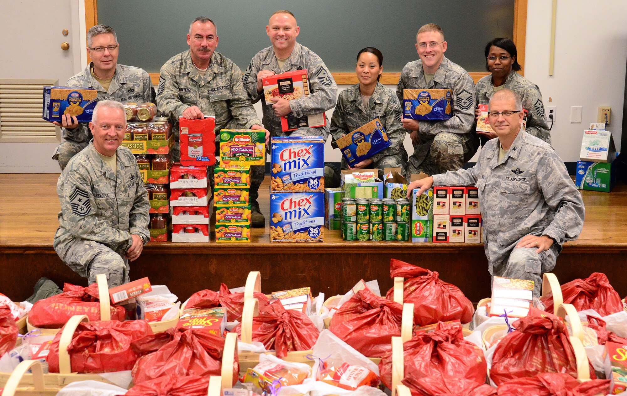 Members of the Dobbins First Sergeants Council, Dobbins Human Resource Development Council, the Lonely Hearts Club and Military Order of the Purple Heart -Chapter 576 met on Dec. 5 to assemble baskets of holiday food for Airmen in need at Dobbins Air Reserve Base. (U.S. Air Force photo/Senior Airman Elizabeth Van Patten)