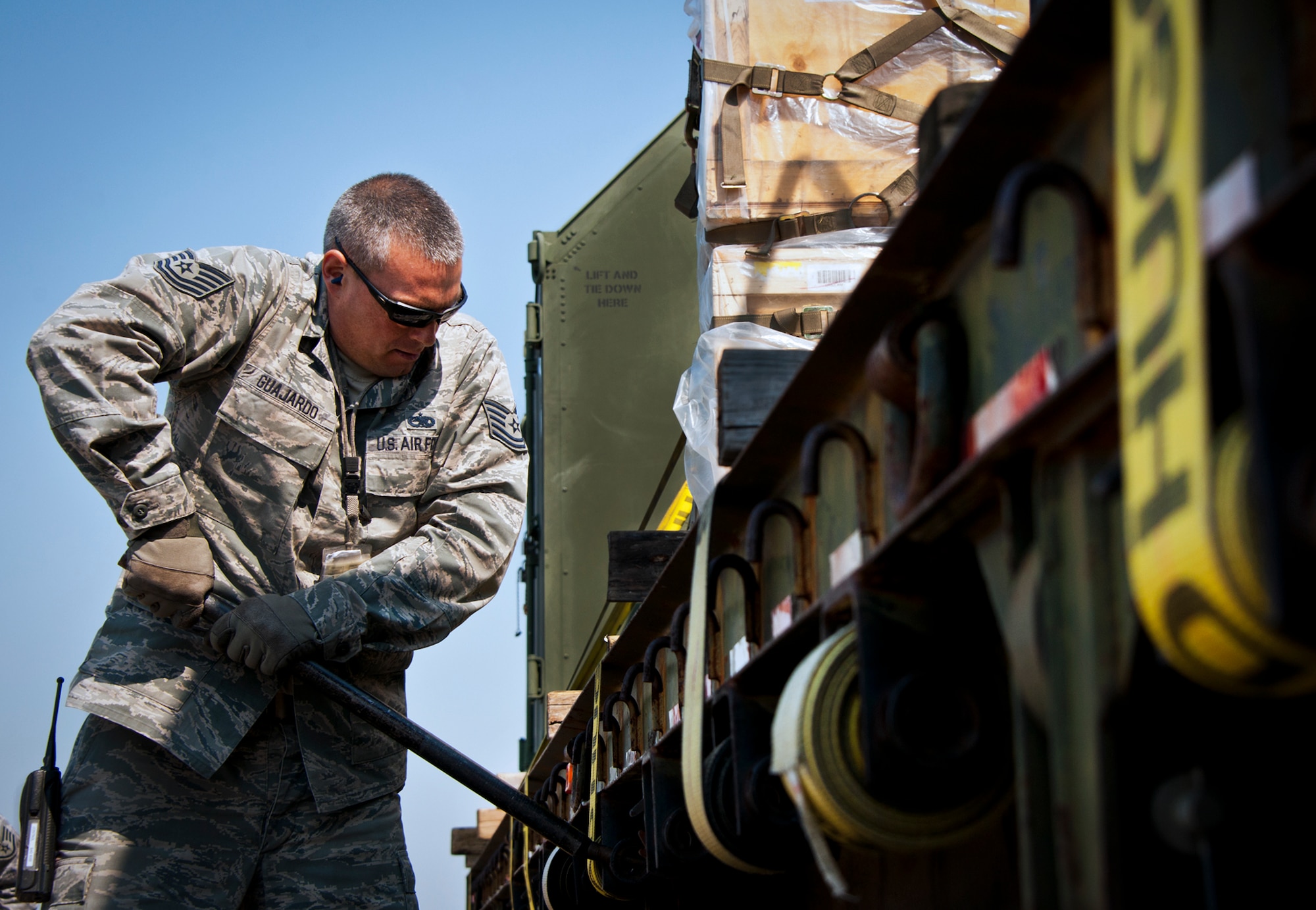 Tech Sgt. Russell Guajardo, of the 482nd Fighter Wing, tightens down the straps holding maintenance equipment on a flat-bed truck March 14 at Eglin Air Force Base, Fla.  The 96th Logistics Readiness Squadron Airmen unloaded approximately 103,165 pounds of maintenance equipment for the 482nd maintenance units participating in a weapons system evaluation program March 18-22.  (U.S. Air Force photo/Samuel King Jr.)