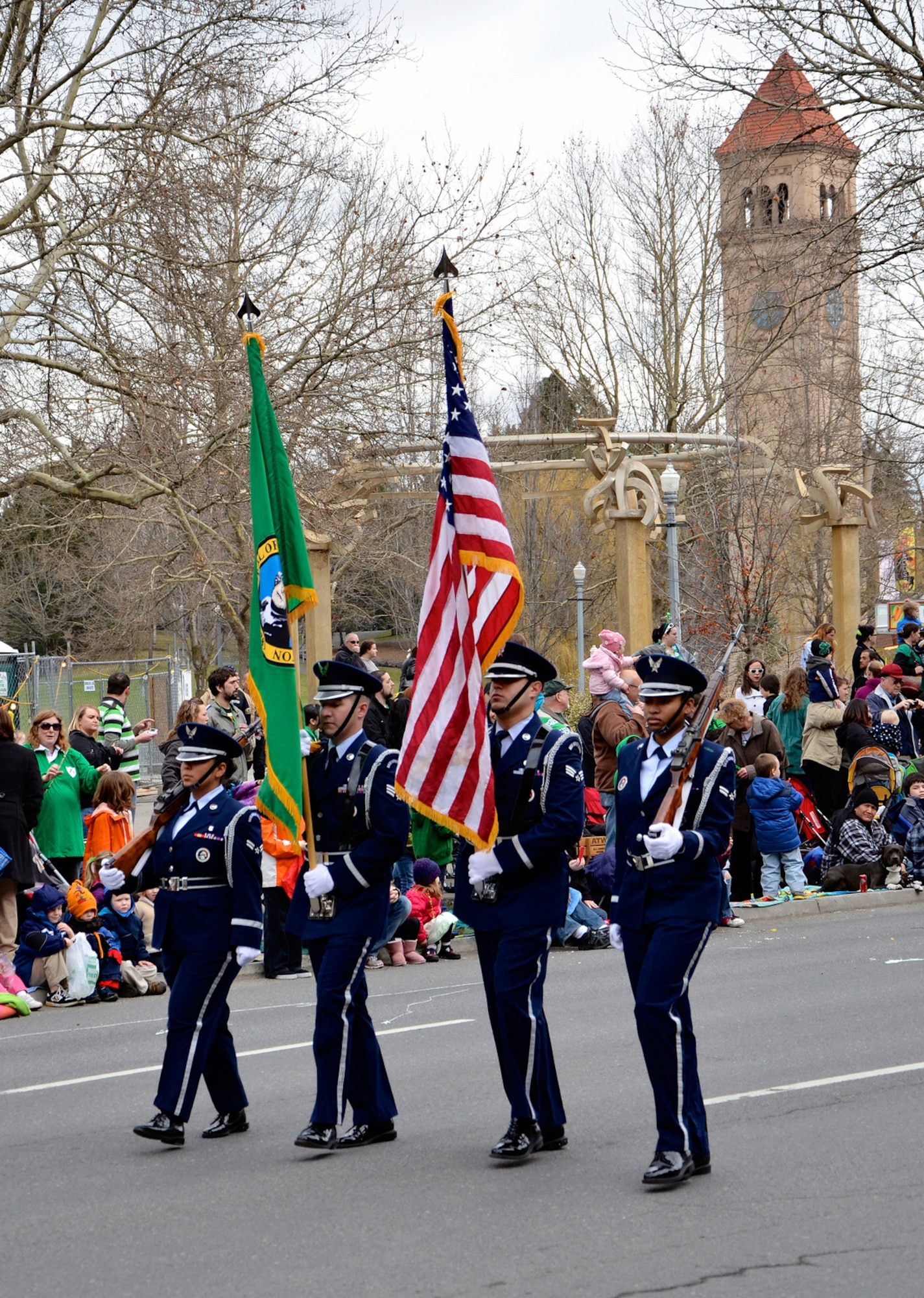 The Fairchild Air Force Base, Wash., Honor Guard head up the 34th Annual St. Patrick’s Day Parade held in downtown Spokane, Wash., brandishing the colors March 16, 2013. The event was organized by The Friendly Sons of St. Patrick non-profit organization and is open for all to get with many of the volunteers coming from Team Fairchild. The base honor guard performs at many similar events around the region allowing the community to show their respect for the colors. (U.S. Air Force photo by Senior Airman Benjamin Stratton)