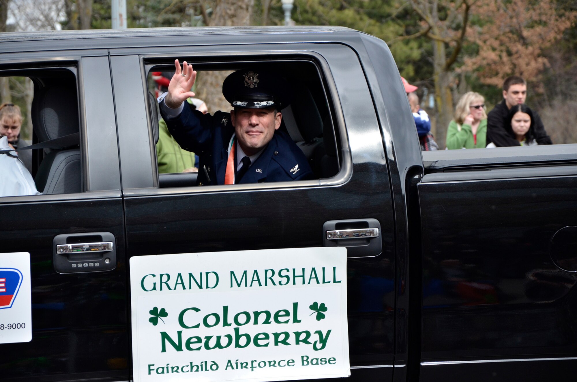 Col. Brian Newberry, the 92nd Air Refueling Wing commander, waves at community members during the 34th Annual St. Patrick’s Day Parade held in downtown Spokane, Wash., and organized by The Friendly Sons of St. Patrick non-profit organization March 16, 2013. The event is open for all to get with many of the volunteers coming from Team Fairchild. Newberry served as the parade’s grand marshall. (U.S. Air Force photo by Senior Airman Benjamin Stratton)