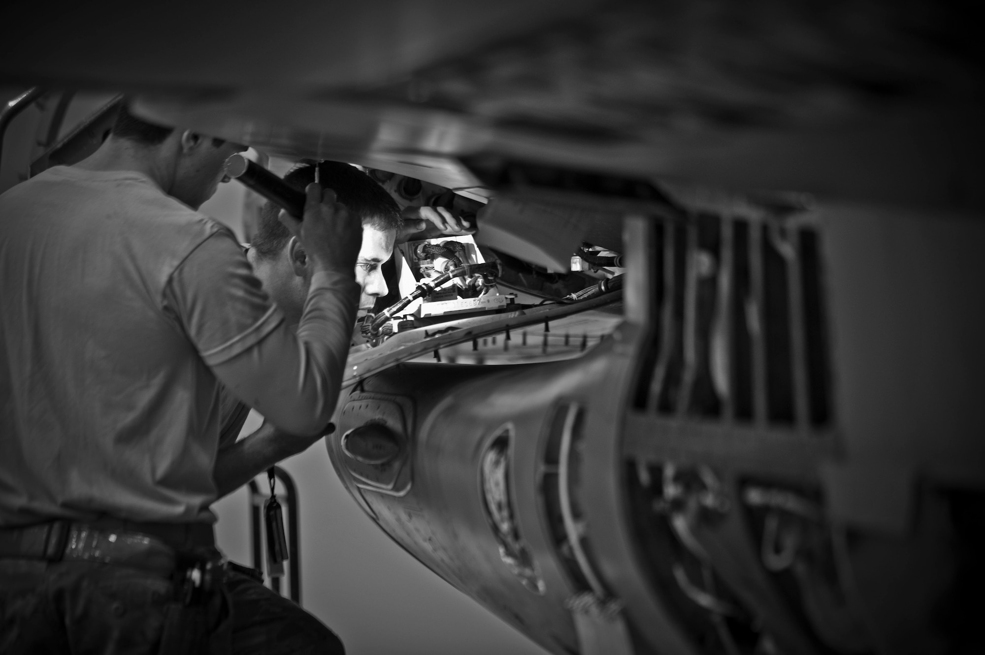 Aircraft maintainers with the 451st Expeditionary Maintenance Squadron inspect an F-16 Fighting Falcon during a 400-flight-hour phase inspection at Kandahar Airfield, Afghanistan, Feb. 26, 2013. The 451st inspects everything on the aircraft from leaks or cracks to anything that may jeopardize the integrity of the aircraft. (U.S. Air Force photo/Senior Airman Scott Saldukas)