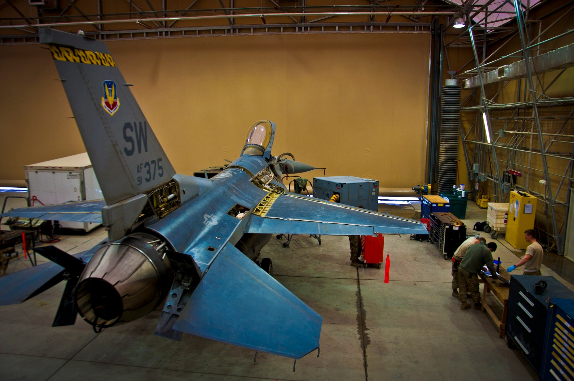 An F-16 Fighting Falcon waits to receive its 400-flight-hour phase inspection at Kandahar Airfield, Afghanistan, Feb. 26, 2013. The 451st Expeditionary Maintenance Squadron inspects everything on the aircraft from leaks or cracks to anything that may jeopardize the integrity of the aircraft. (U.S. Air Force photo/Senior Airman Scott Saldukas)
