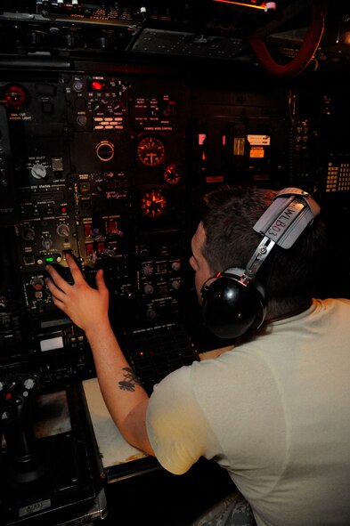 Staff Sgt. Christopher Ueckler, 2nd Maintenance Group Weapons Standardization, inspects the navigation systems of a B-52H Stratofortress during a training exercise on Barksdale Air Force Base, La., March 15. The exercise reinforced munitions Airmen's skills in loading and unloading munitions quickly and effectively in a combat situation. (U.S. Air Force photo/Airman 1st Class Andrew Moua)