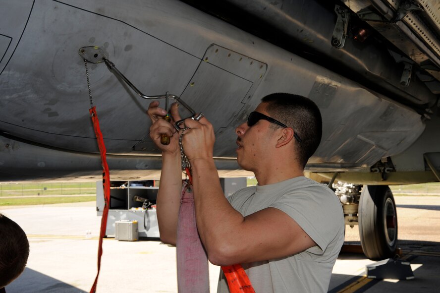 Senior Airman Gildo Pena-Lopez, 2nd Maintenance Group Weapons Standardization, de-arms an inert AGM-86B cruise missile during a training exercise on Barksdale Air Force Base, La., March 15. The exercise reinforced munitions Airmen's skills in loading and unloading munitions in order to respond quickly while in a deployed location. (U.S. Air Force photo/Airman 1st Class Andrew Moua)