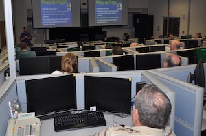 Soldiers, Airmen and civilians attend SKYWARN Storm Spotter training March 14, 2013 at the Emergency Operations Center on Fort Eustis, Va. The training teaches students how to become weather spotters so they can provide time-sensitive weather information to the National Weather Service, Joint Base Langley-Eustis and the Hampton Roads communities. (U.S. Air Force photo by Tech. Sgt. April Wickes/Released)