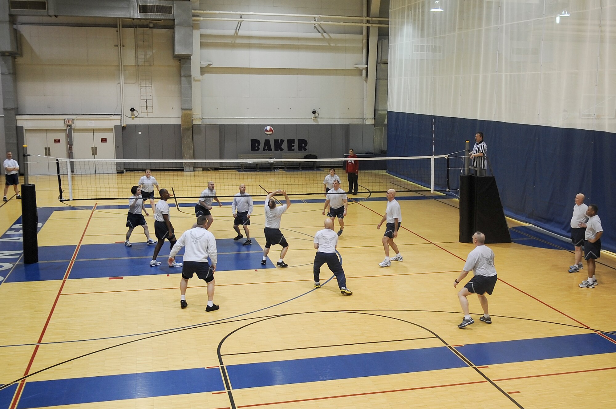 Eielson chiefs and first sergeants compete during a volleyball match at the Baker Field House March 11, 2013, Eielson Air Force Base, Alaska. The chiefs won two out of three matches, but each team donated money to support the Air Force Assistance Fund kick-off this week. (U.S. Air Force photo/Airman 1st Class Zachary Perras)