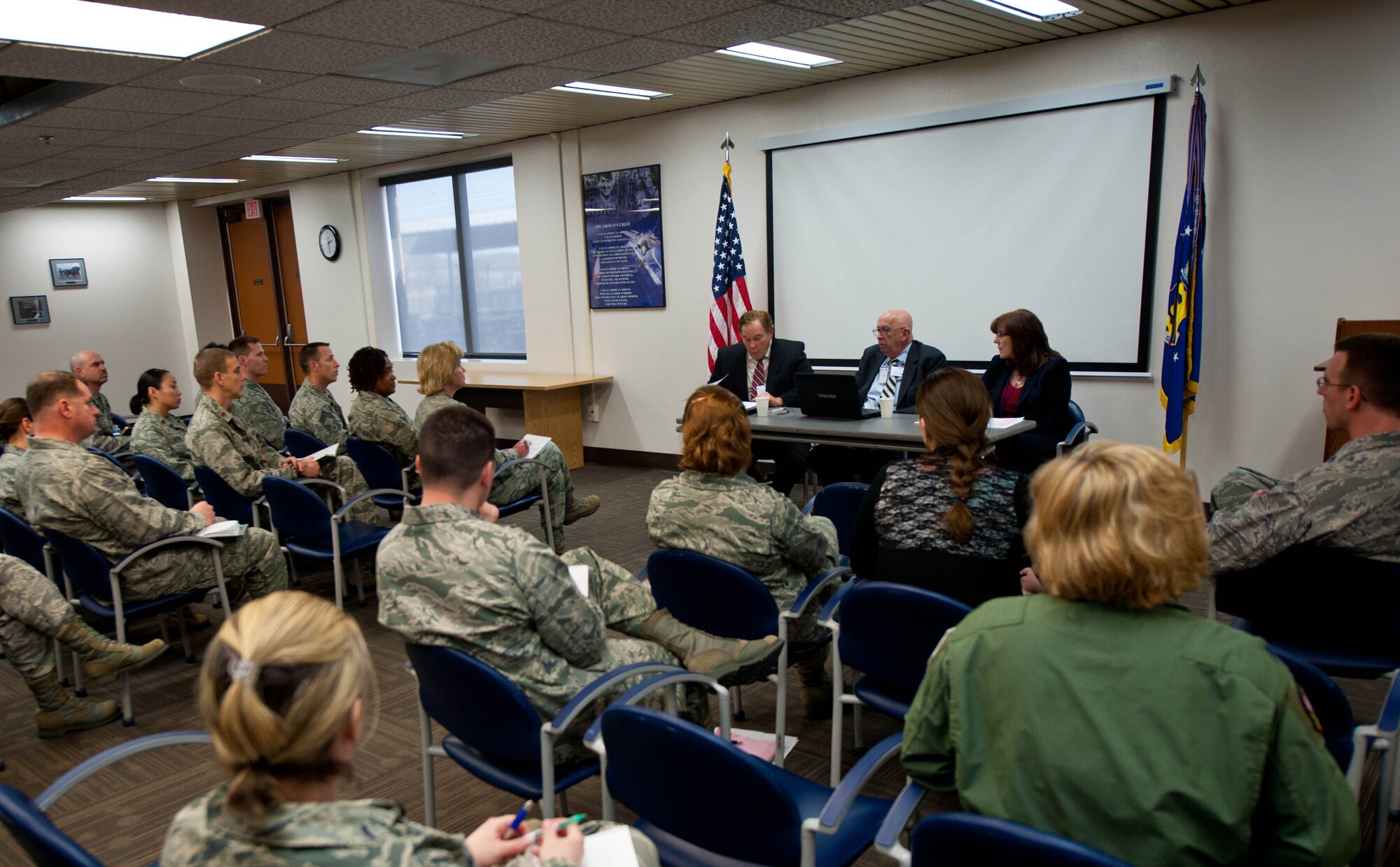 Benjamin Snyder, Paul Allen and Cheryle Pistone, Accredition Association for Ambulatory Health Care, Inc. surveyors, discuss their findings after a three-day inspection of the 28th Medical Group at Ellsworth Air Force Base, S.D., March 14, 2013. The AAAHC is a private, non-profit organization and is the preeminent leader in developing standards to advance and promote patient safety, quality and value for ambulatory healthcare through peer-based accreditation processes, education and research. (U.S. Air Force photo by Airman 1st Class Zachary Hada/Released)