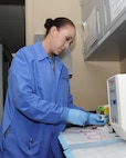 Tech. Sgt. Brenda Torres, 359th Medical Support Squadron Biomedical Laboratory Flight technician, processes urinalysis samples at the Joint Base San Antonio-Randolph Medical Clinic Laboratory.  (U.S. Air Force photo by Melissa Peterson)


