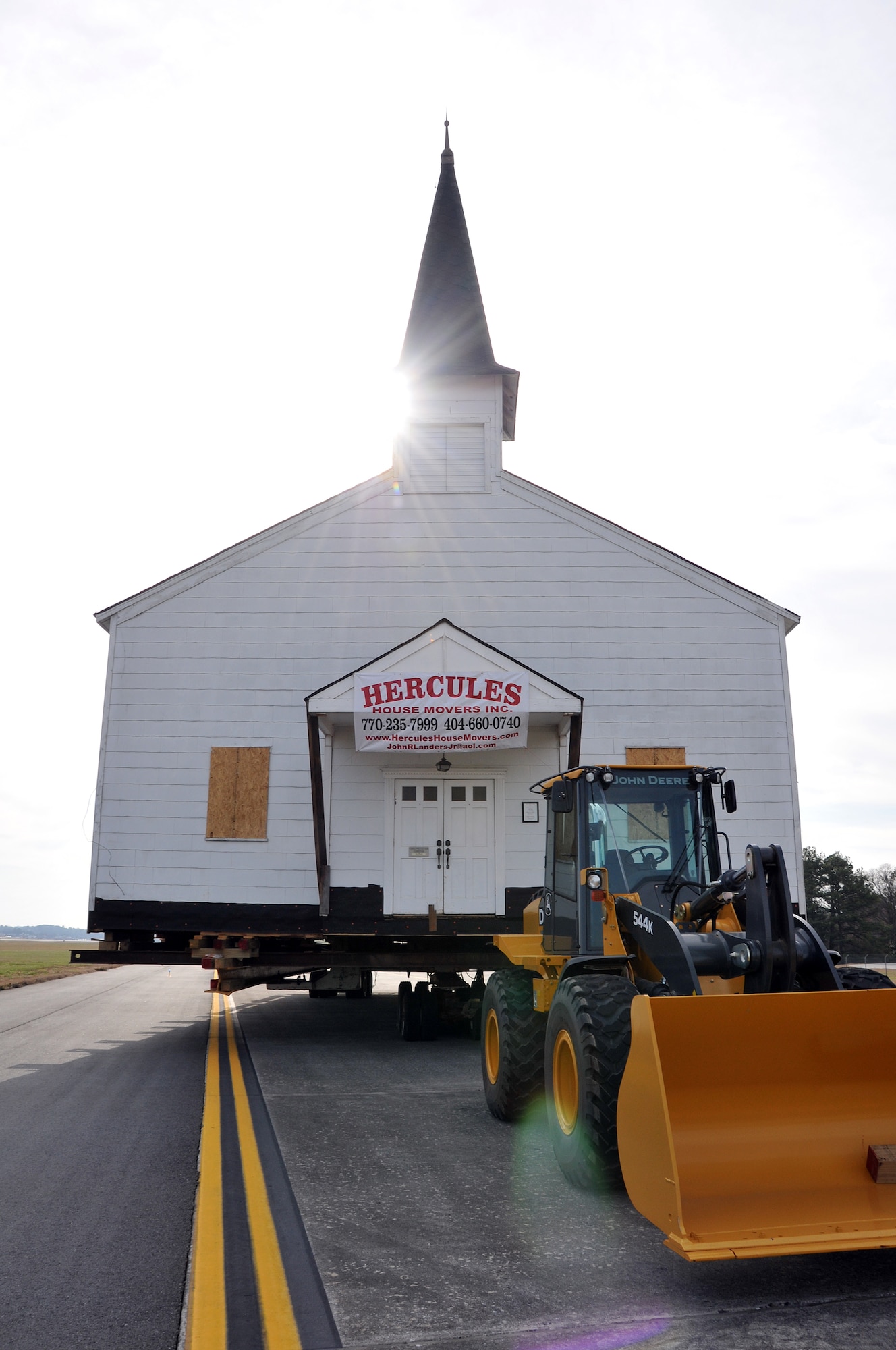 The Dobbins Air Reserve Base chapel waits on the Dobbins ARB taxiway on March 17, for the final phase of its relocation to the Army National Guard side of the base. The Dobbins chapel taxied across the Dobbins ARB, Ga., runway to the Army National Guard side of the base following a ceremony honoring its service to the nation’s military members. (U.S. Air Force photo/Senior Airman Elizabeth Van Patten)