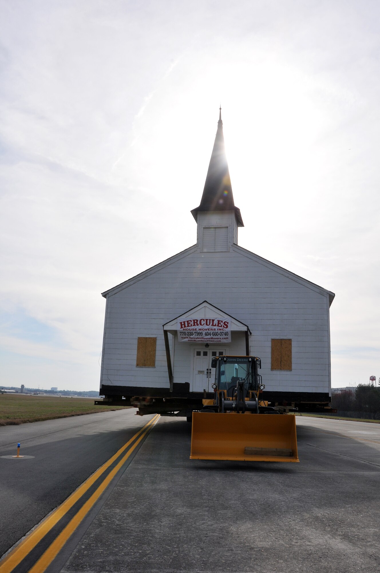 The Dobbins Air Reserve Base chapel waits on the Dobbins ARB taxiway on March 17, for the final phase of its relocation to the Army National Guard side of the base. The Dobbins chapel taxied across the Dobbins ARB, Ga., runway to the Army National Guard side of the base following a ceremony honoring its service to the nation’s military members. (U.S. Air Force photo/Senior Airman Elizabeth Van Patten)