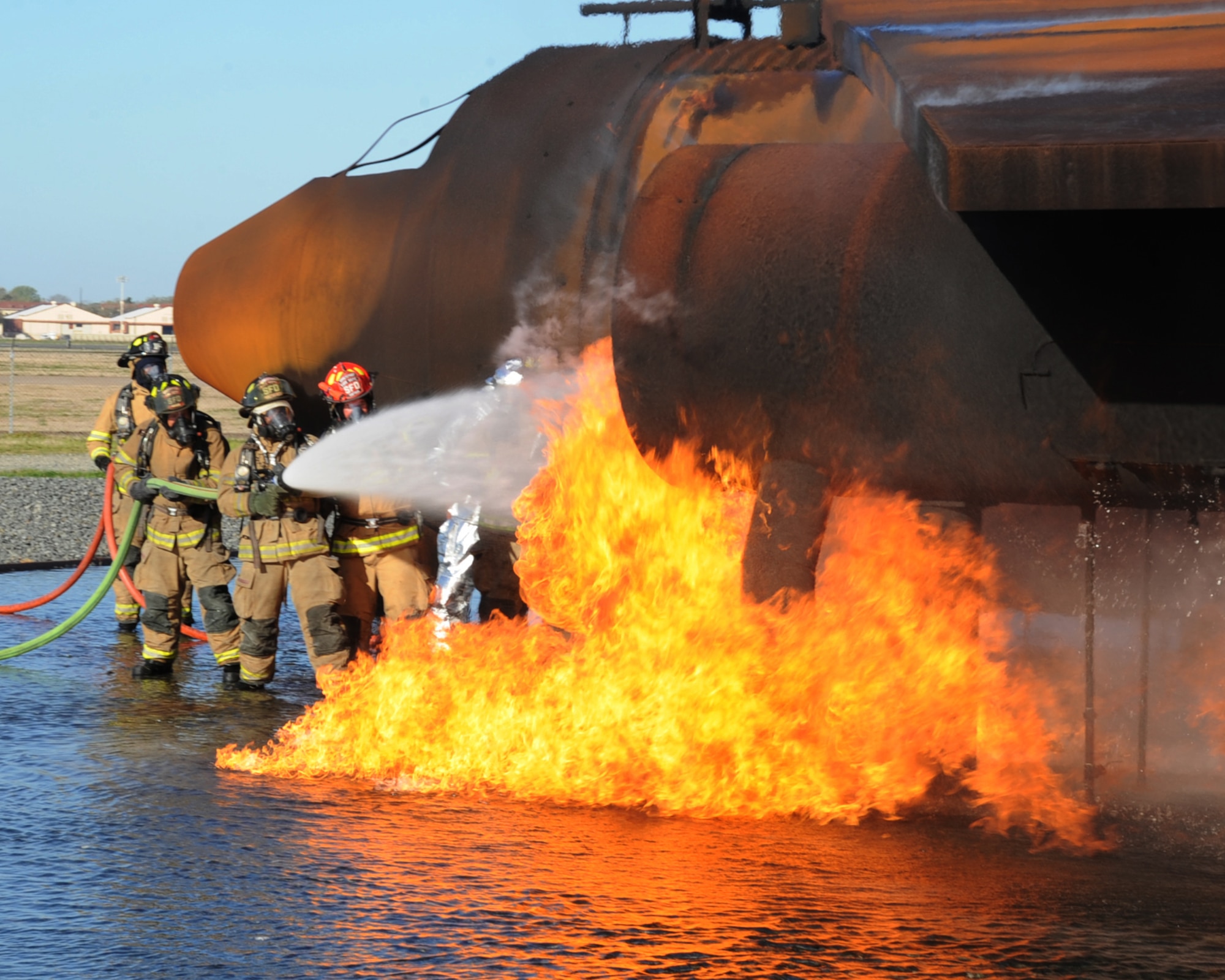 Firefighters from the Shreveport Fire Department extinguish an aircraft fire during a joint training exercise on Barksdale Air Force Base, La., March 15. Barksdale's Fire Department invited Shreveport fire fighters to use their facility and complete their annual aircraft training. (U.S. Air Force photo/Senior Airman Sean Martin)