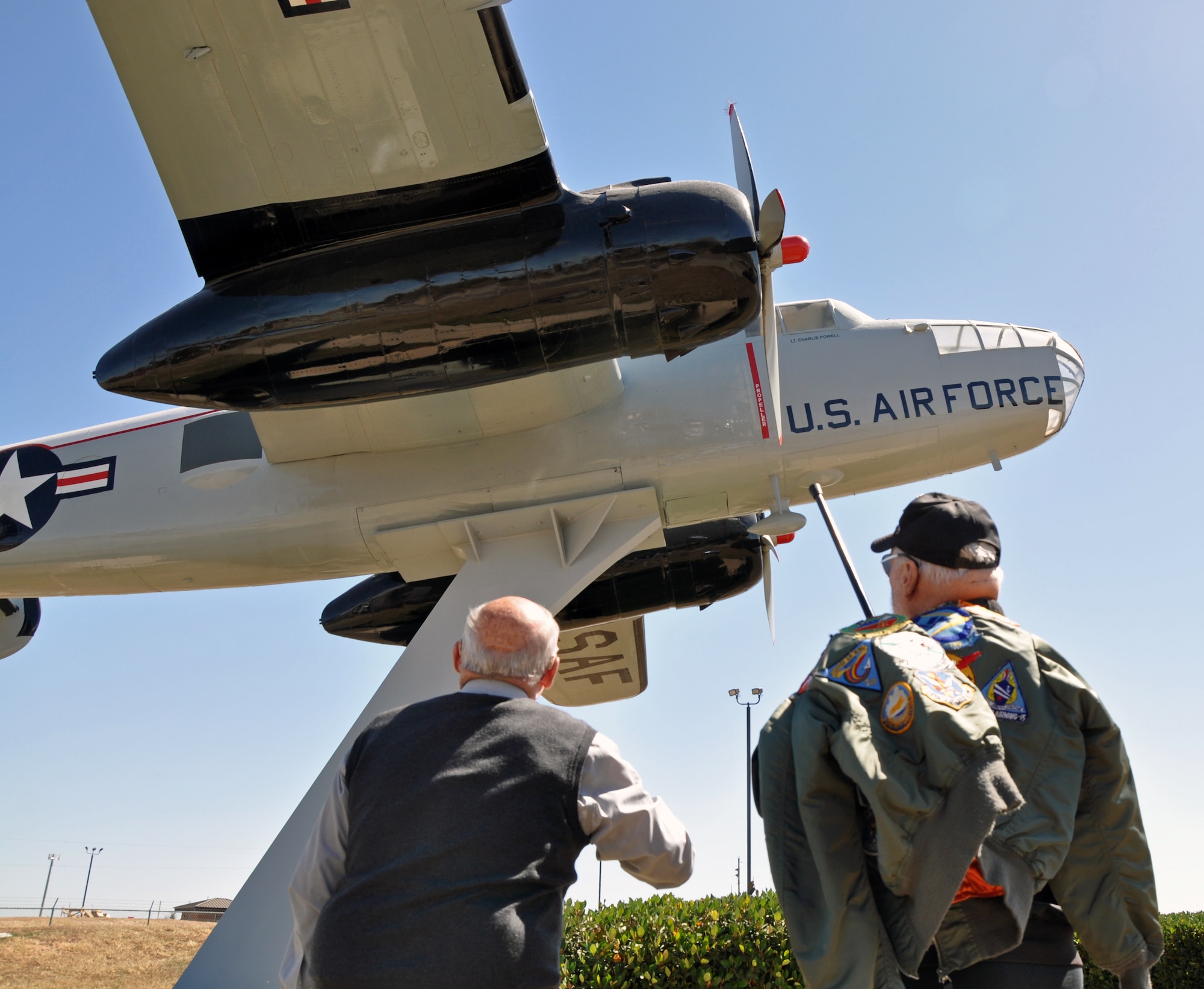 GOODFELLOW AIR FORCE BASE, Texas--Retired Col. Charles Powell, former 17th Training Wing commander and George Baker, Vietnam-era U.S. Air Force pilot, speak about the rich heritage of the B-25 aircraft located by the Jacobson gate. Baker was reunited with his aircraft here, thinking it had disappeared after delivering it to the “boneyard” in Tucson, Ariz. in 1962. (U.S. Air Force photo/1st Lt Leanne Hedgepeth)