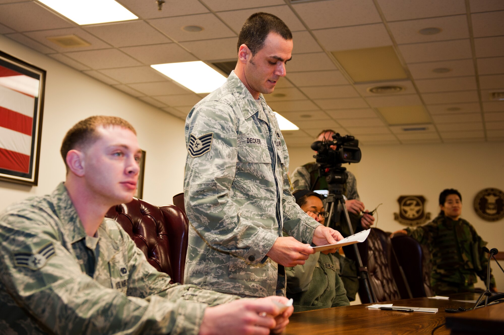 Tech. Sgt. Jason Decker, 8th Fighter Wing role player, asks a question during a simulated press conference for exercise Beverly Midnight 13-2 at Kunsan Air Base, Republic of Korea, Mar. 18, 2013. Decker and others were simulating how the media might respond under various conditions. (U.S. Air Force photo by Staff Sgt. Jonathan Fowler/Released)