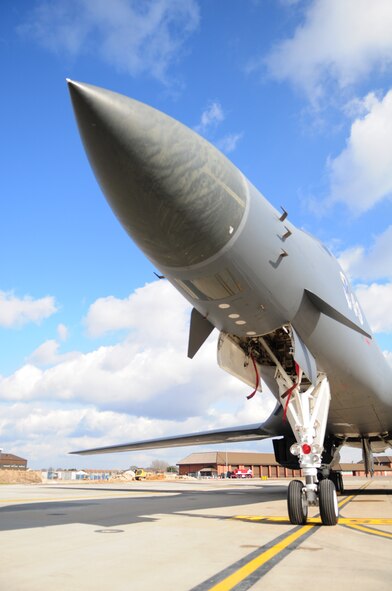 A B-1B Lancer, here from the 28th Bomb Wing, Ellsworth Air Force Base, S.D., sits on the airfield at RAF Mildenhall March 14, 2013, The B-1B is a highly versatile, multi-mission weapon system. Its synthetic aperture radar is capable of tracking, targeting and engaging moving vehicles, as well as self-targeting and terrain-following modes. In addition, an extremely accurate global positioning system-aided inertial navigation system enables aircrews to navigate without the aid of ground-based navigation aids, as well as engage targets with a high level of precision. (U.S. Air Force Photo by Karen Abeyasekere/Released)