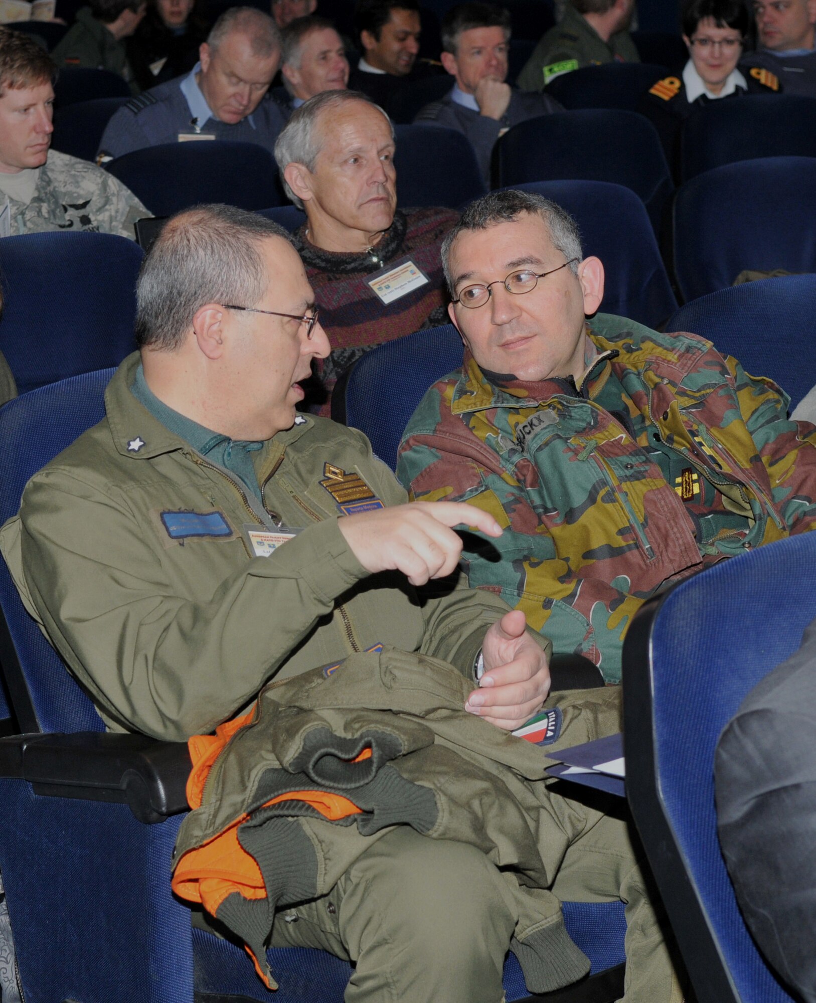 Nearly 200 medical professionals from 16 nations share conversation before the start of the 28th Annual U.S. Air Forces in Europe-Air Forces Africa European Flight Surgeons Conference at the Hercules here Theater March 11. The conference focused on the aerospace operations mission, building partnerships and advancements in aerospace medicine. Attendees also took part in the NATO Science and Technology Organization Technical Course. U.S. Air Force Photo by Tech. Sgt. James M. Hodgman