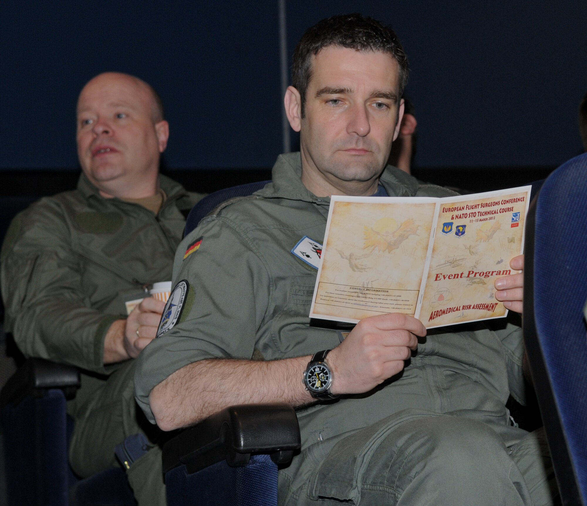 One of nearly 200 attendees of the 28th Annual U.S. Air Forces in Europe-Air Forces Africa European Flight Surgeons Conference reviews the event's program inside the Hercules Theater here March 11. Medical professionals from 16 nations attended the weeklong conference which ended March 15 and focused on the aerospace operations mission, building partnerships and advancements in aerospace medicine. Attendees also took part in the NATO Science and Technology Organization Technical Course.  U.S. Air Force Photo By Tech. Sgt. James M. Hodgman