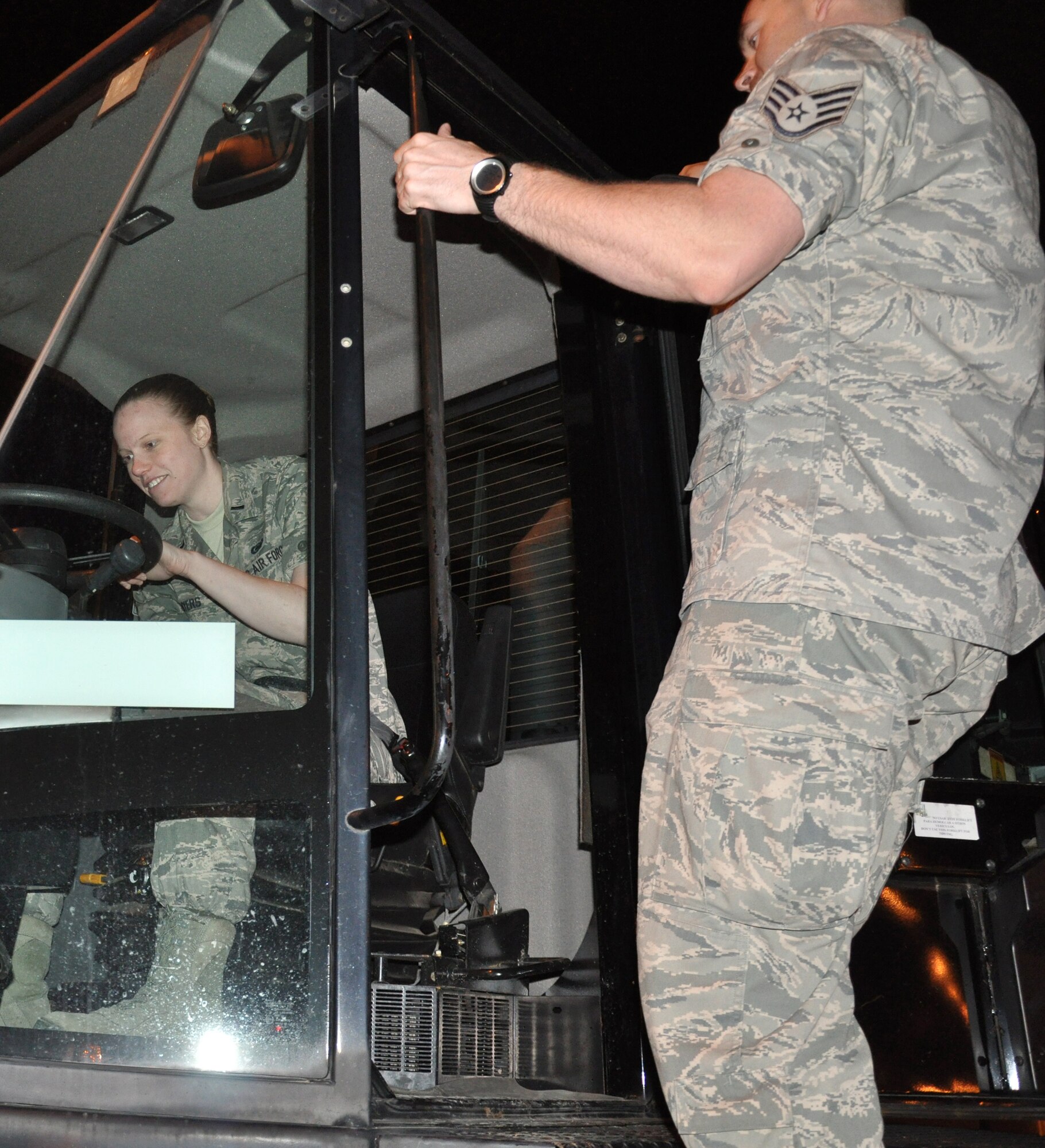Staff Sgt. Michael Cox, 100th Logistics Readiness Squadron, gives 10,000-pound, all-terrain forklift training to 1st Lt. Kelly Myers, 100th LRS, at a deployed location in southwest Europe March 14, 2013. Cox is a Tenino, Wash., native, and Myers is from Lima, Ohio. Airmen and KC-135 Stratotankers from the 100th Air Refueling Wing, RAF Mildenhall, England, deployed to the 351st Expeditionary Air Refueling Squadron Jan. 26, 2013, to support French operations in Mali. (U.S. Air Force photo by Capt. Jason Smith)