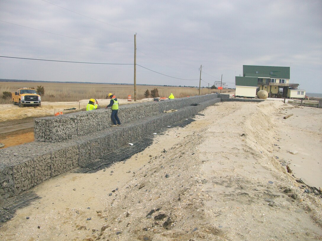 The U.S. Army Corps of Engineers Philadelphia District completed construction in March of 2013 on the East Point Shoreline Protection Project in NJ. Work involved excavating the area, placing marine mattresses, and positioning gabion baskets (cages filled with rocks) on top of the mattresses and sediment.