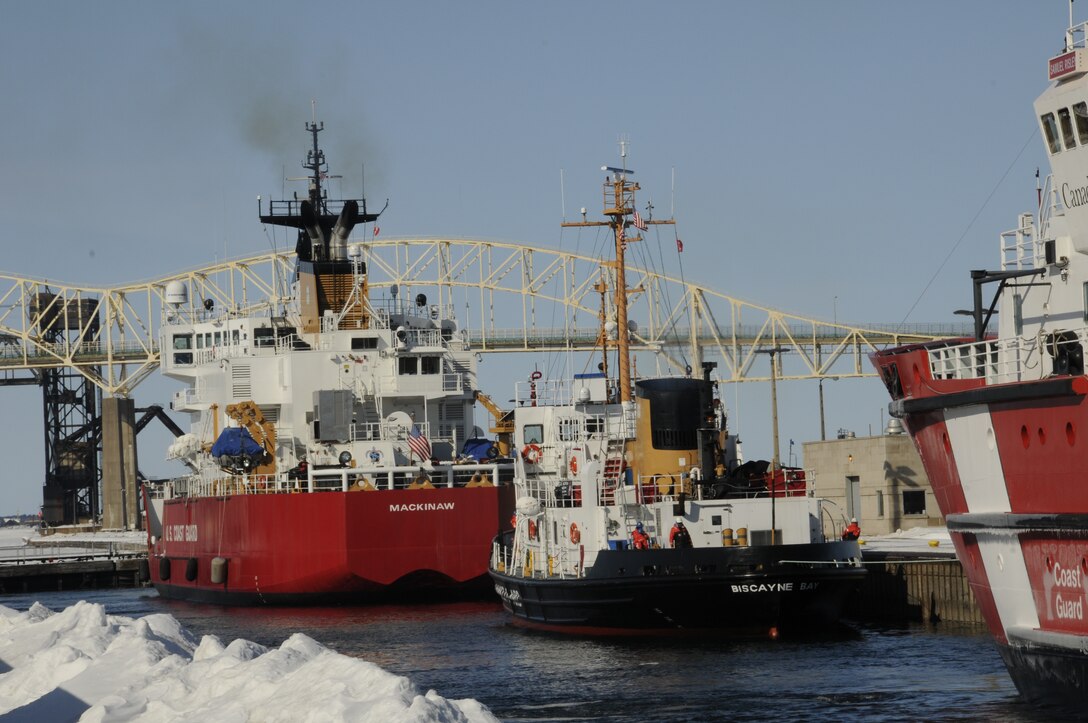US Coast Guard cutters Mackinaw and Biscayne Bay lock through the Poe Lock at the Soo Locks March 14 during ice breaking operations on the Great Lakes.
