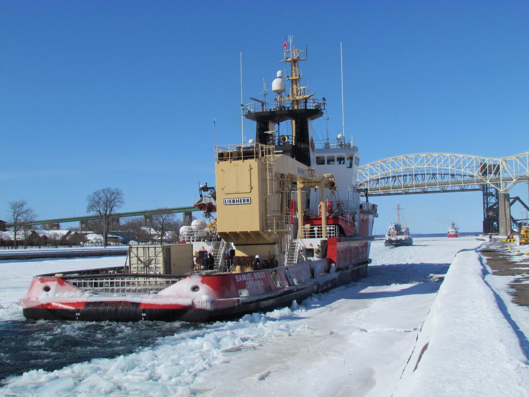 With the Canadian Coast Guard Cutter Samuel Risley bringing up the rear, the U.S. Coast Guard Cutters Mackinaw, and Biscayne Bay head into the upper river after leaving the Poe Lock.