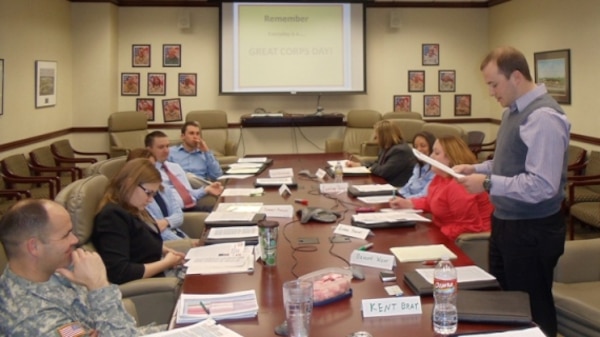 The Leadership Development Team II reads short biographies of themselves during their kick off meeting. Pictured from left are Maj. Don Nestor, Tulsa USACE deputy district commander, Cara Wulf, Tammy Piazza, Matthew Piazza, David Blackmore, Debra Overstreet, Courtney Perry, Lindsey Sherrell, and Braden West. Kent Bray is not pictured. 