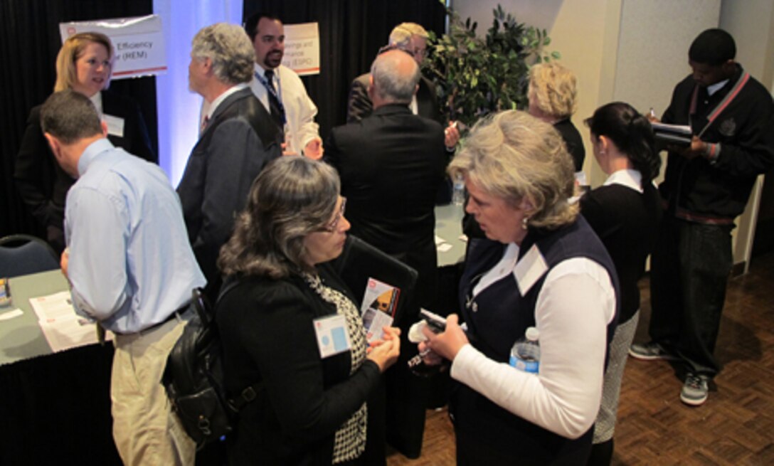 Tammy Learned (right), Huntsville Center’s Energy Optimization Branch chief, speaks with Rachael Martin, a managing partner at GDP Energy Solutions LLC,  of Birmingham, Ala., at the 2012 Huntsville Center Small  Business Forum, Nov. 9. 