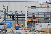 At the Blue Grass Chemical Agent Destruction Pilot Plant, a crane lifts a roofing panel for placement on the Munitions Demilitarization Building (MDB) Feb. 15, 2013. Placement of roofing panels in other areas of the MDB set in motion other indoor work, such as electrical and piping.
