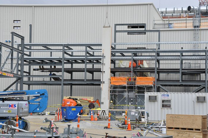 At the Blue Grass Chemical Agent Destruction Pilot Plant, a crane lifts a roofing panel for placement on the Munitions Demilitarization Building (MDB) Feb. 15, 2013. Placement of roofing panels in other areas of the MDB set in motion other indoor work, such as electrical and piping.
