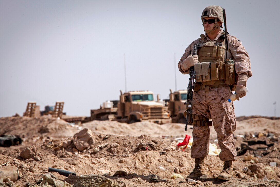 U.S. Marine Corps Staff Sgt. Marcos E. Baeza observes Afghan national army counterparts during a clearing operation near Camp Shorabak in Afghanistan’s Helmand province, March 16, 2013. Baeza, an equipment advisor, is assigned to the 215th Corps Engineer Advisor Team, 2nd Combat Engineer Battalion, Regimental Combat Team 7.