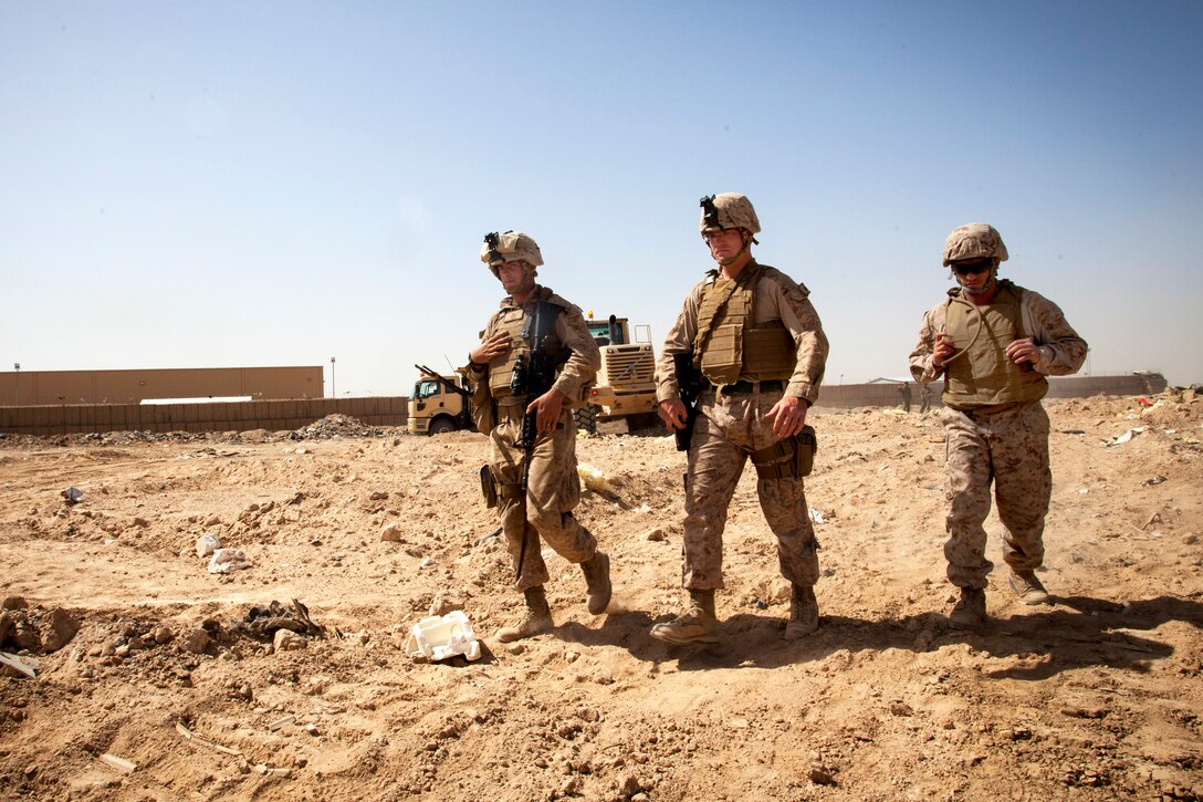 U.S. Marines supervise Afghan national army engineer counterparts during a clearing operation near Camp Shorabak in Afghanistan’s Helmand province, March 16, 2013.