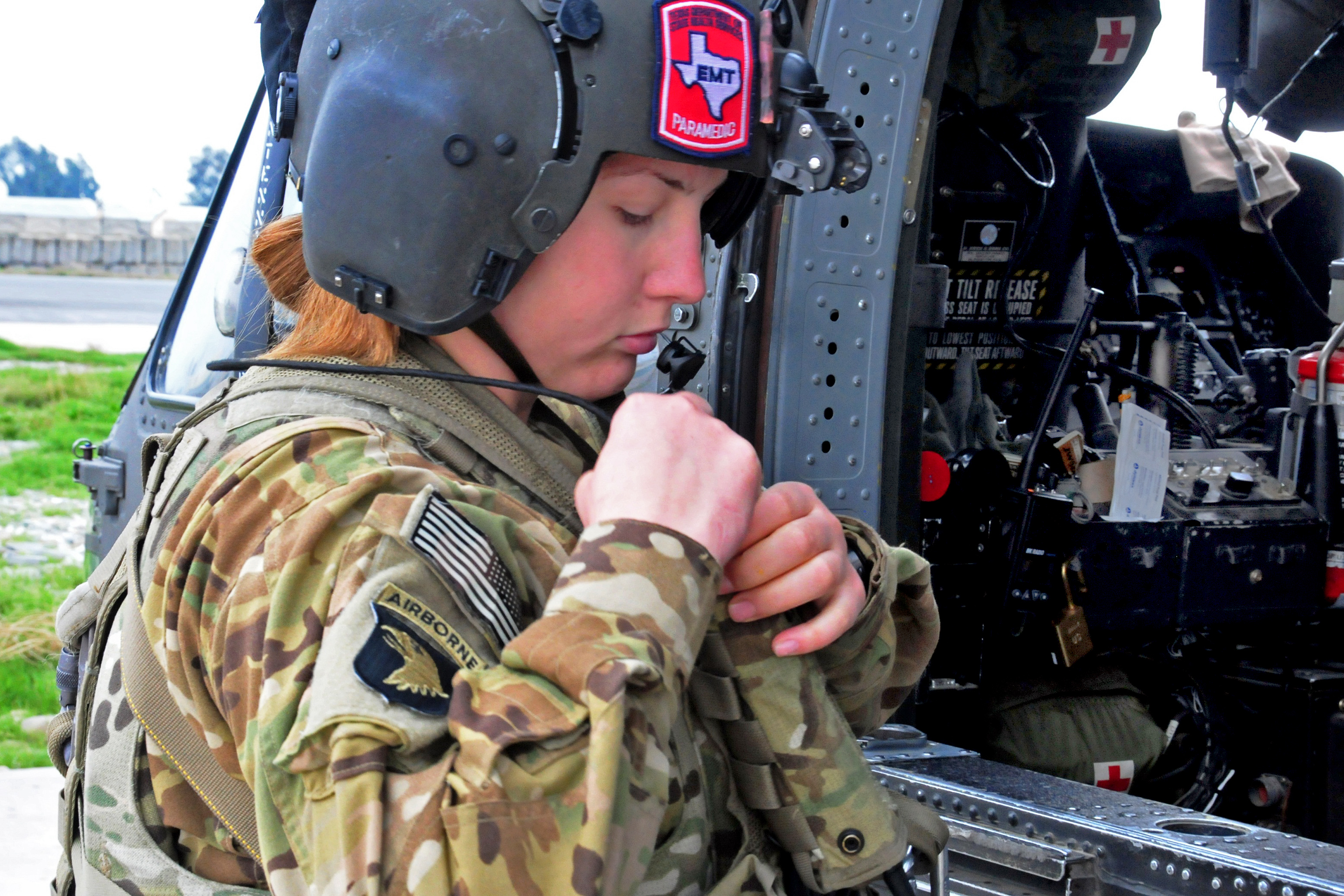 U.s. Army Pfc. Laci Lognion Puts On Her Personal Protective Equipment  During A Pre-Flight Exercise