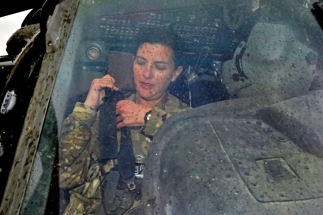 U.S. Army Chief Warrant Officer 2 Bethany Bump conducts her pre-flight routine in a UH-60 Black Hawk helicopter before a mission on Jalalabad Airfield in Afghanistan's Nangarhar province, March 13, 2013. Bump, a helicopter pilot, is assigned to the 101st Airborne Division's Company C, 3rd Battalion, 501st Combat Aviation Brigade, 1st Brigade Combat Team.