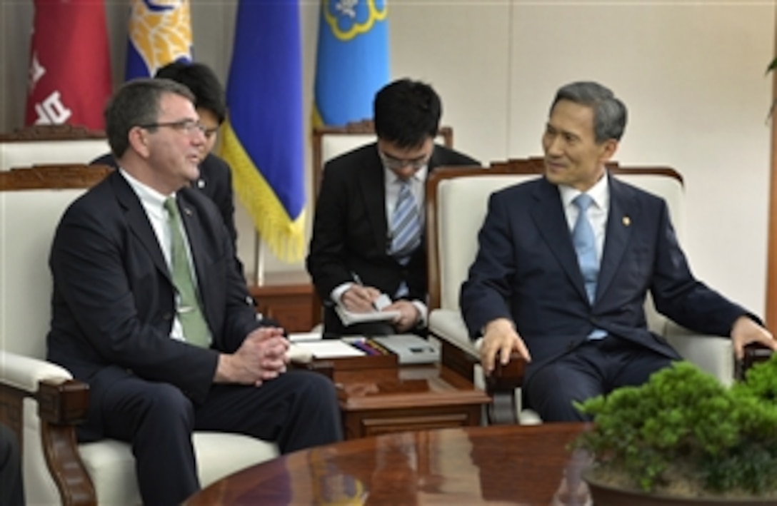 Deputy Secretary of Defense Ashton B. Carter, left, meets with South Korea's Minister of National Defense Kim Kwan-jin, right, in Seoul, South Korea, on March 18, 2013. The two leaders are meeting to discuss the rebalancing of U.S. forces to the Asia-Pacific region and as well as the recent provocative actions by North Korea.